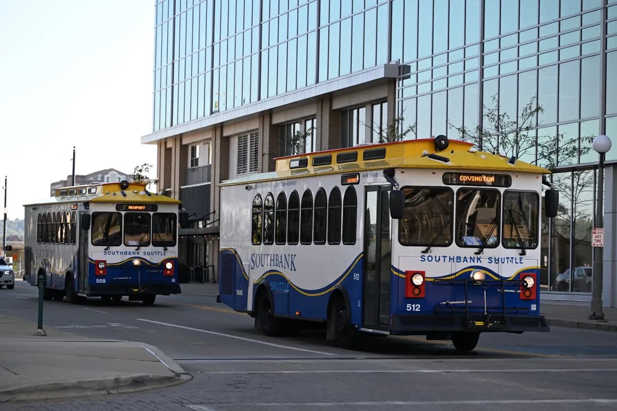 Downtown shuttle trolleys on a city street — guest shuttle transportation between the hotel and the wedding venue